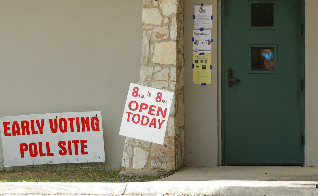 APTOPIX Virus Outbreak Texas Early Voting